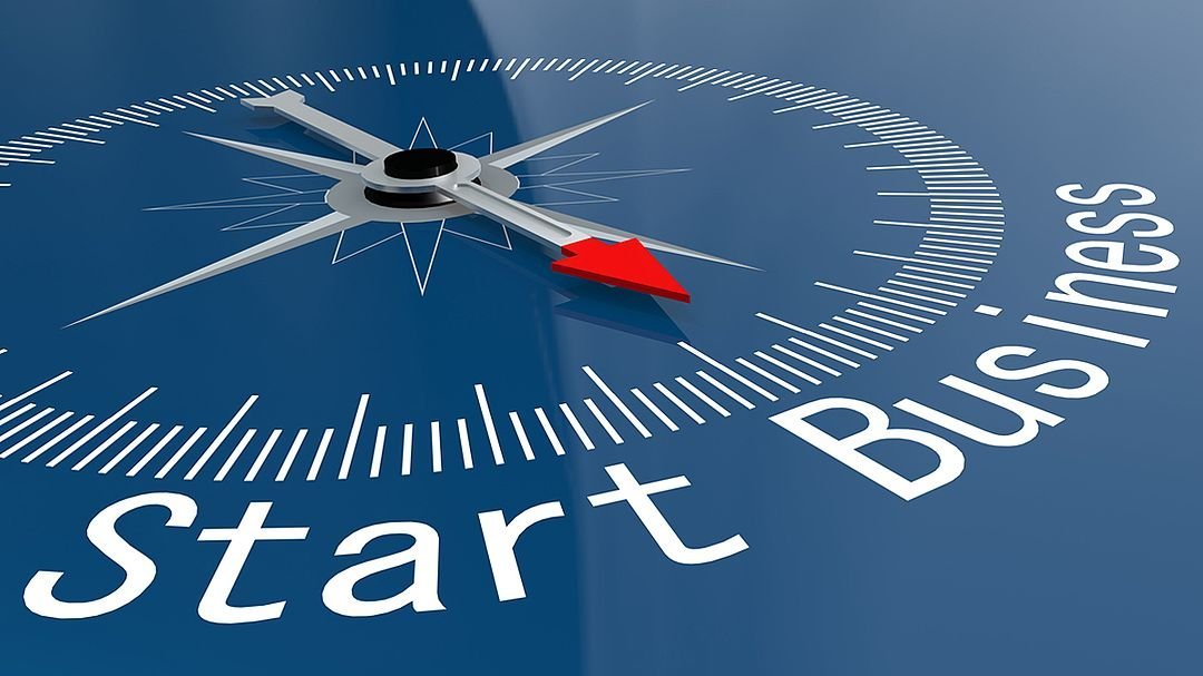 Eine Kompassnadel zeigt in Richtung Start Business