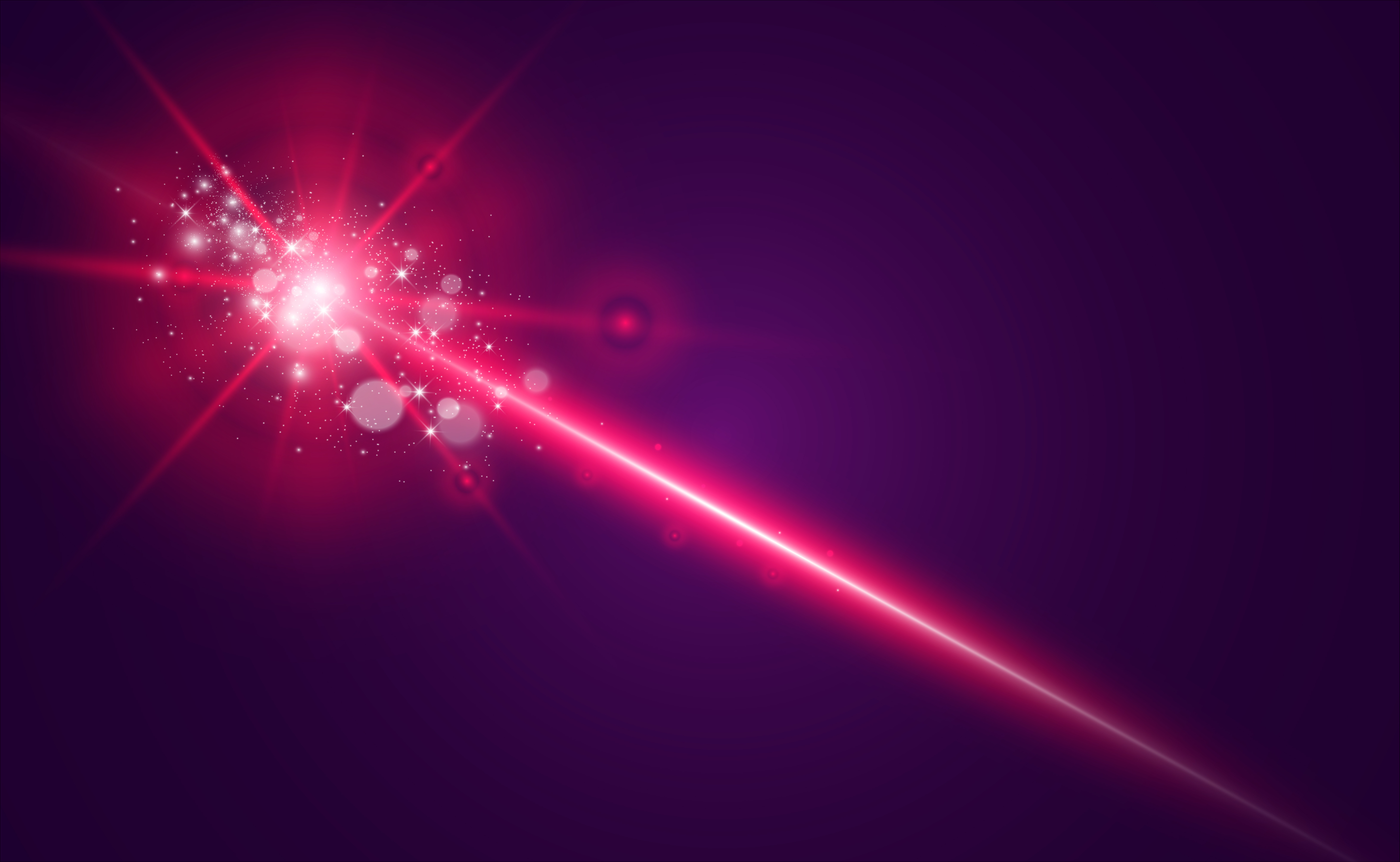 Symbolbild Laserstrahl - roter Strahl vor sternenartigen Hintergrund.