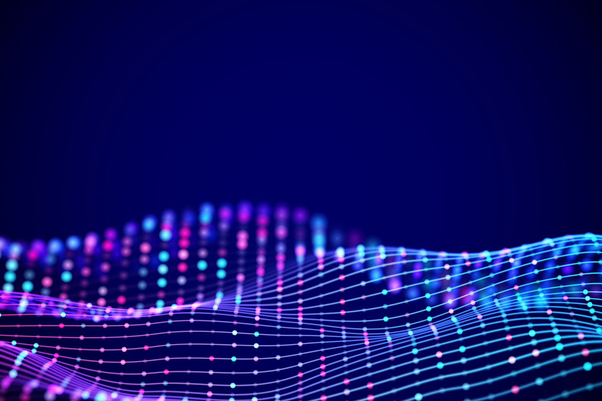 Ein Netz aus blauen, pinken und lilafarbenen Lichtpunkten vor blauem Hintergrund